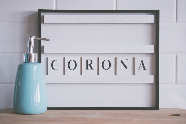 Dispenser with soap and Corona word