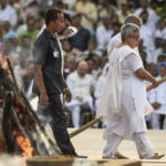 Daughter performing last rites